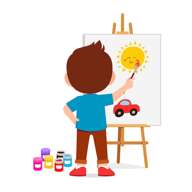 Happy cute little kid boy draw on canvas