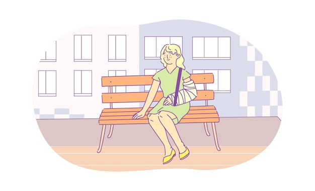 Injured young woman with broken arm sitting on bench outdoors