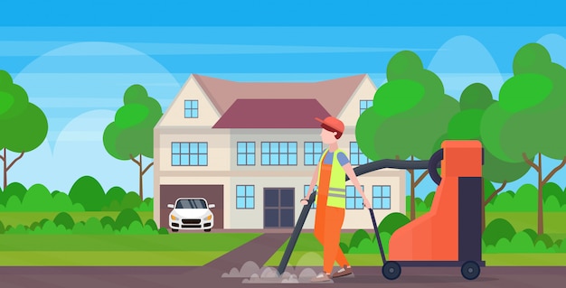 male street worker using industrial vacuum cleaner man vacuuming garbage streets cleaning service concept modern cottage house countryside background full length flat horizontal