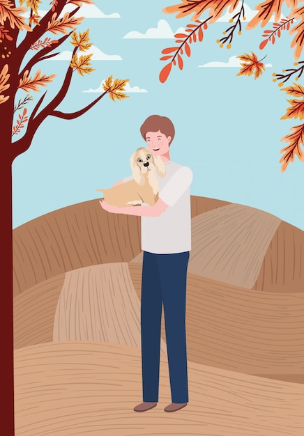 Young man with cute dog mascot in the autumn camp