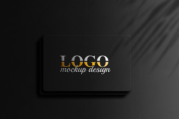 3D-Gold-Logo-Mockup-Design auf schwarzer Wandstruktur