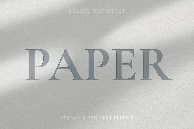 PSD modelo editável de efeito de texto em relevo psd em fundo de textura de papel