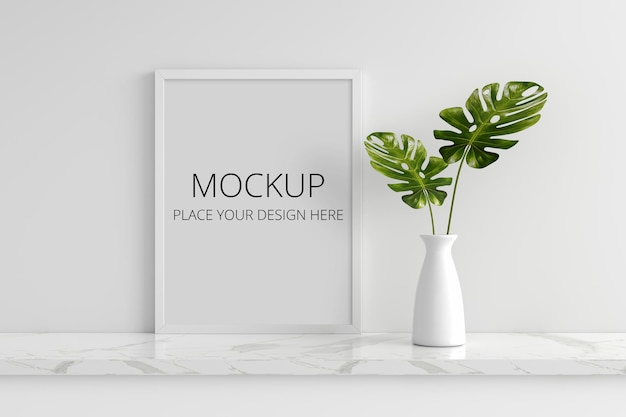 Pianta di monstera in vaso con mockup di cornice