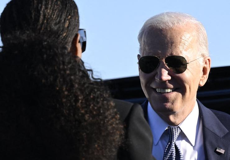 President Joe Biden says goodbye to former first lady Michelle Obama on Nov. 28, 2023, before boarding Air Force One after an appearance in Marietta, Georgia.