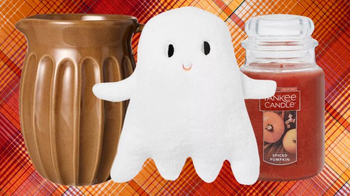 A stoneware pitcher, ghost pillow and spiced pumpkin Yankee Candle.