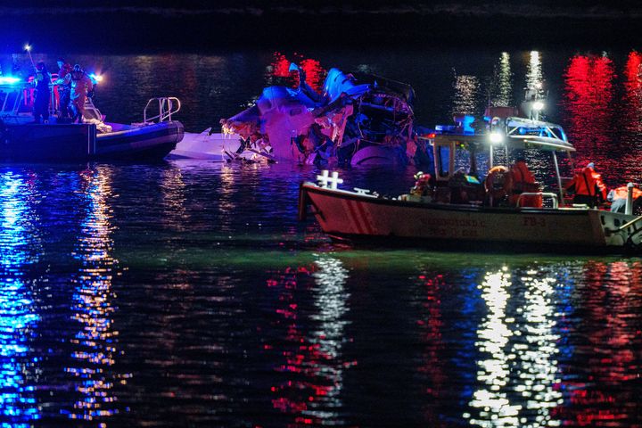 Emergency response teams asses airplane wreckage in the Potomac River near Ronald Reagan Washington Airport.