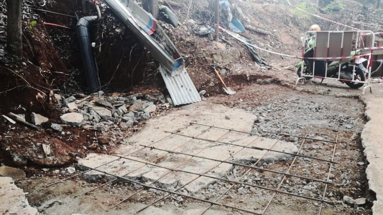 Recovery of damaged public road access around the project site of the under-construction Jakarta-Bandung high-speed railway near Cikampek.