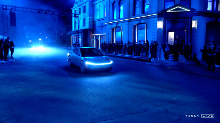 Tesla's robotaxi is seen at an unveiling event in Los Angeles, California, US, on Oct. 10, 2024, in this still image taken from a video.