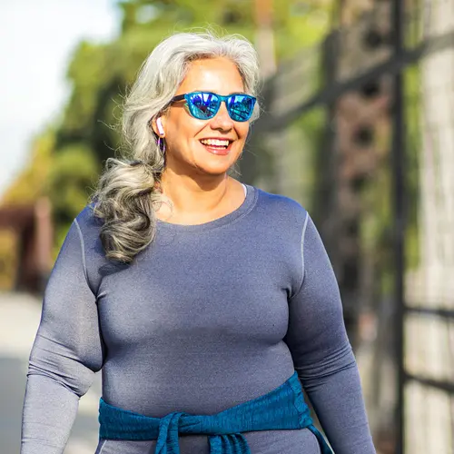 photo of mature woman walking for exercise