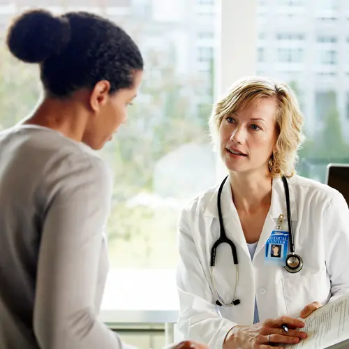 photo of doctor and patient talking,