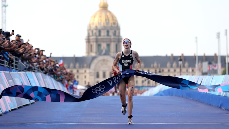 Cassandre Beaugrand of Team France crosses the line to win gold in the Women's Individual Triathlon