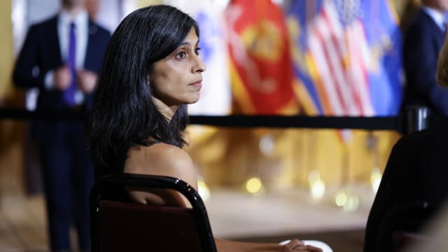 Usha Vance listens to her husband at VFW Post 92 in New Kensington, Pennsylvania.