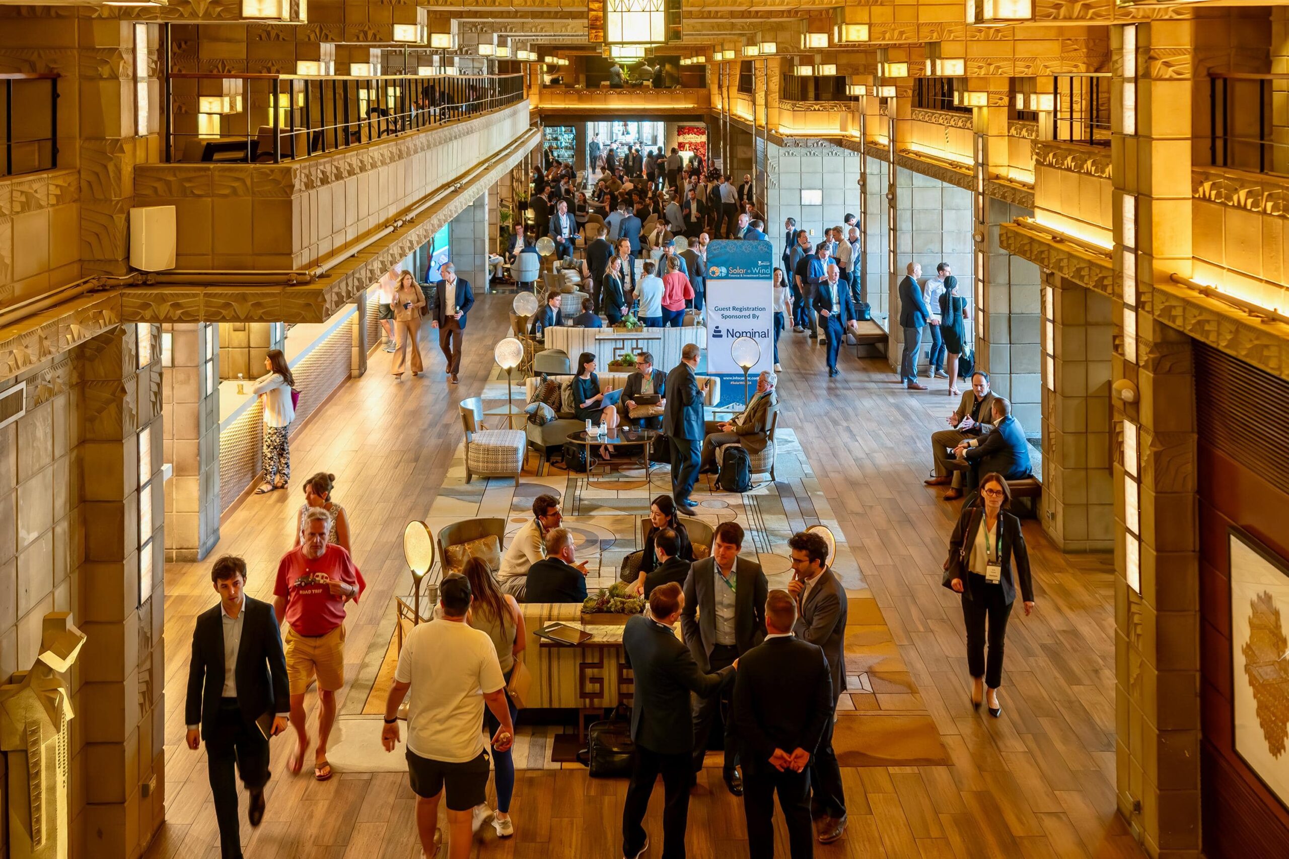 An aerial shot of the busy hotel lobby at Solar + Wind 2024