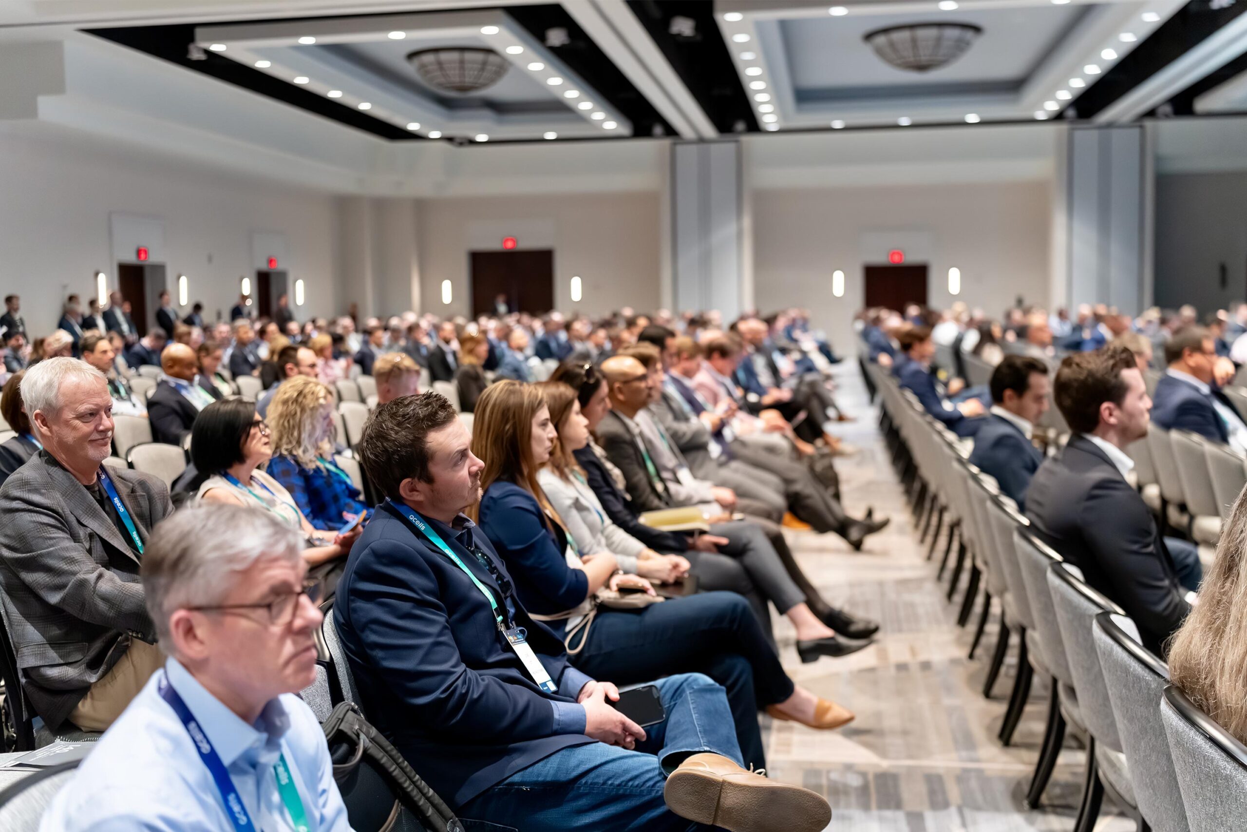 Many seated Solar + Wind 2024 attendees attentively listening to a presentation