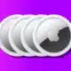 image of apple airtags on purple background