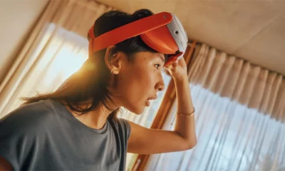 A person is using a meta Quest 3 virtual reality headset.