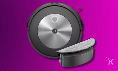 Robot vacuum cleaner on purple background.