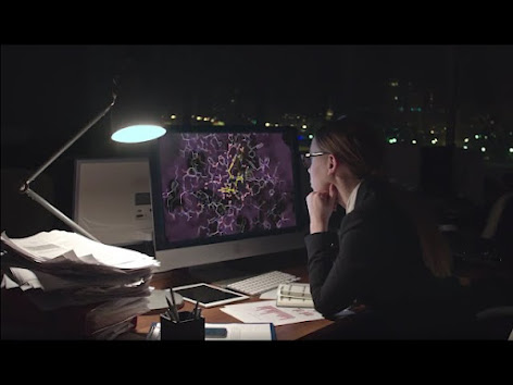 Schrodinger researcher sitting at computer visualizing molecules