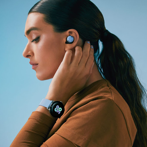 A person wears some Pixel Buds and a matching Google Pixel Watch 2.