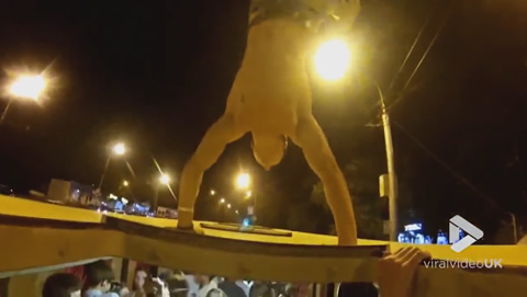 Guy exits bus through the roof