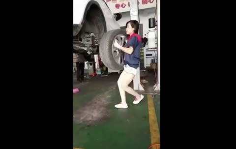 Chinese girl working at a tire shop
