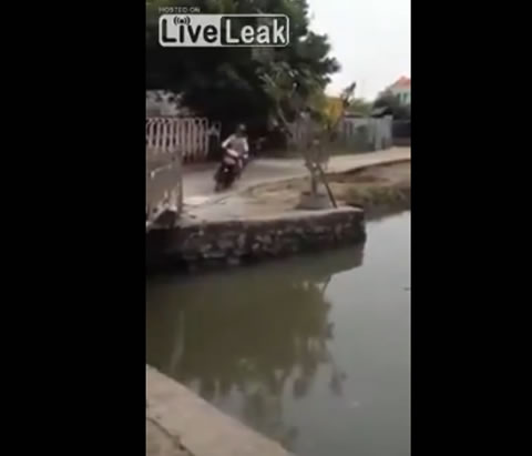 Biker_falls_into_river