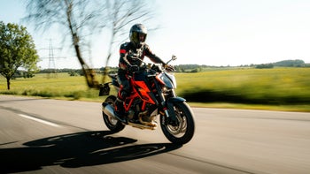 An image on a person riding a KTM bike in a rural area.