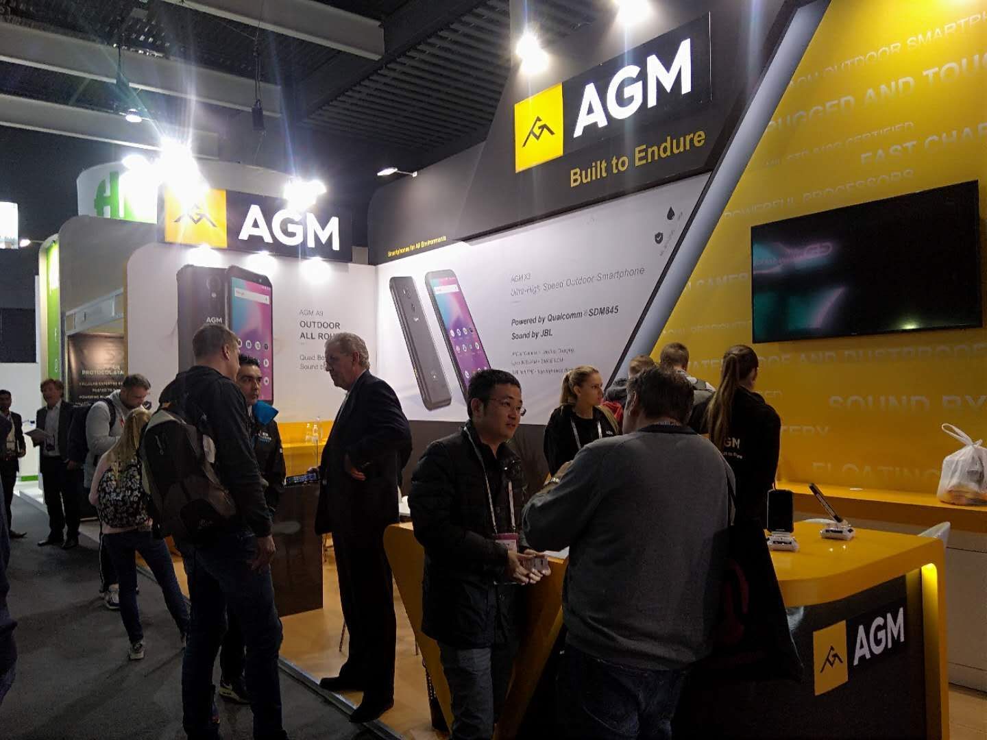 AGM booth at MWC - AGM is at MWC: super-durable phones coming to Europe, partnered with JBL for superior audio