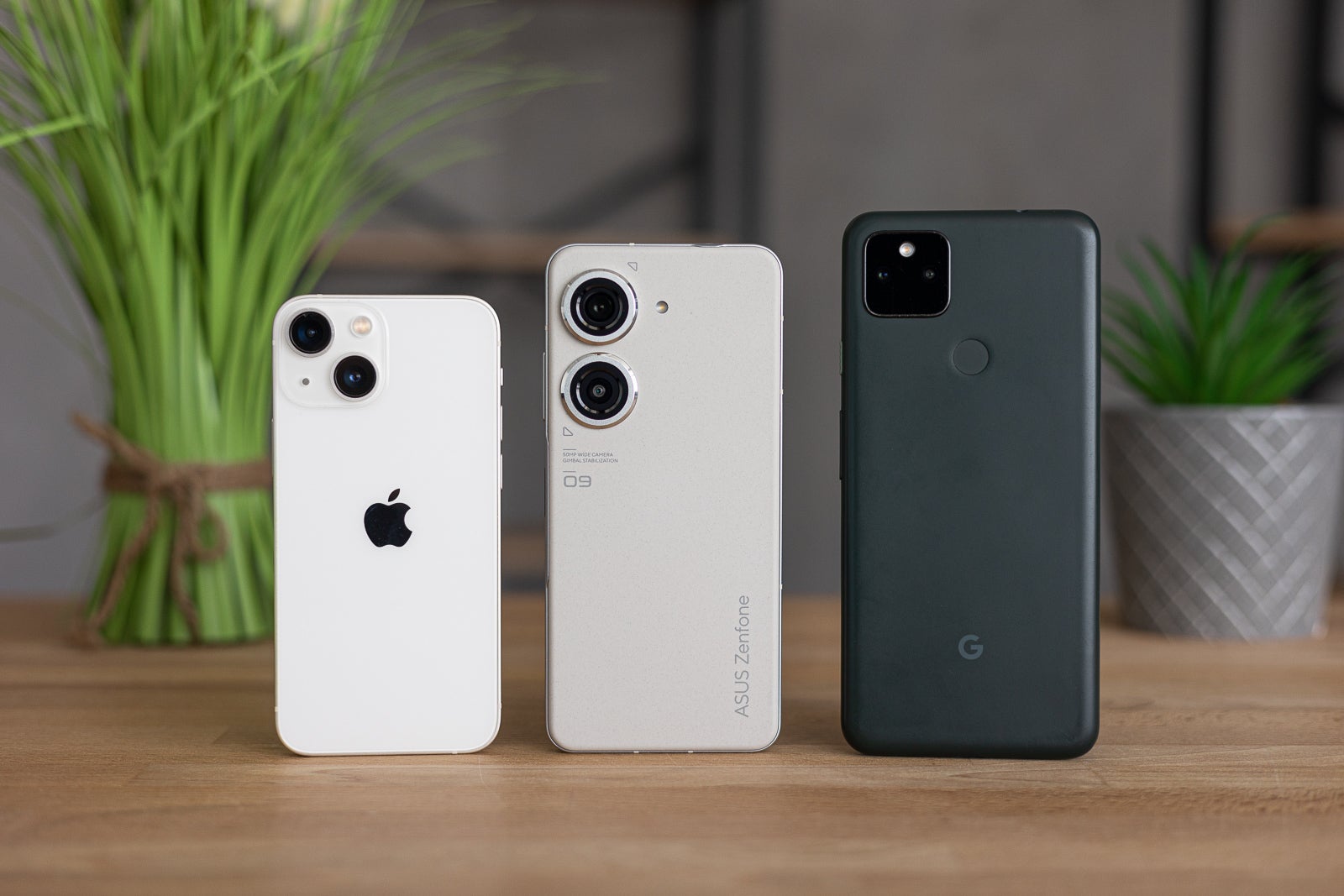 From left to right - iPhone 13 mini, ZenFone 9, Pixel 5a (Image credit PhoneArena) - In search of the perfect compact phone: Asus ZenFone 9