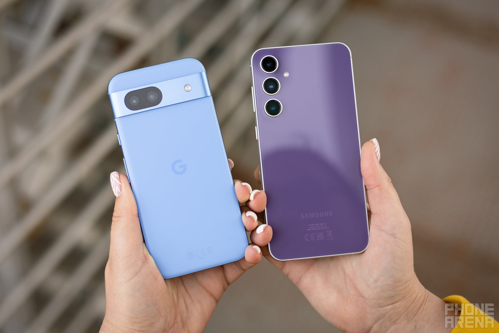 Pixel 8a vs Galaxy S23 FE from the back. (Image by PhoneArena) - Google Pixel 8a vs Samsung Galaxy S23 FE: Is it worth paying $130 more for the Fan Edition?