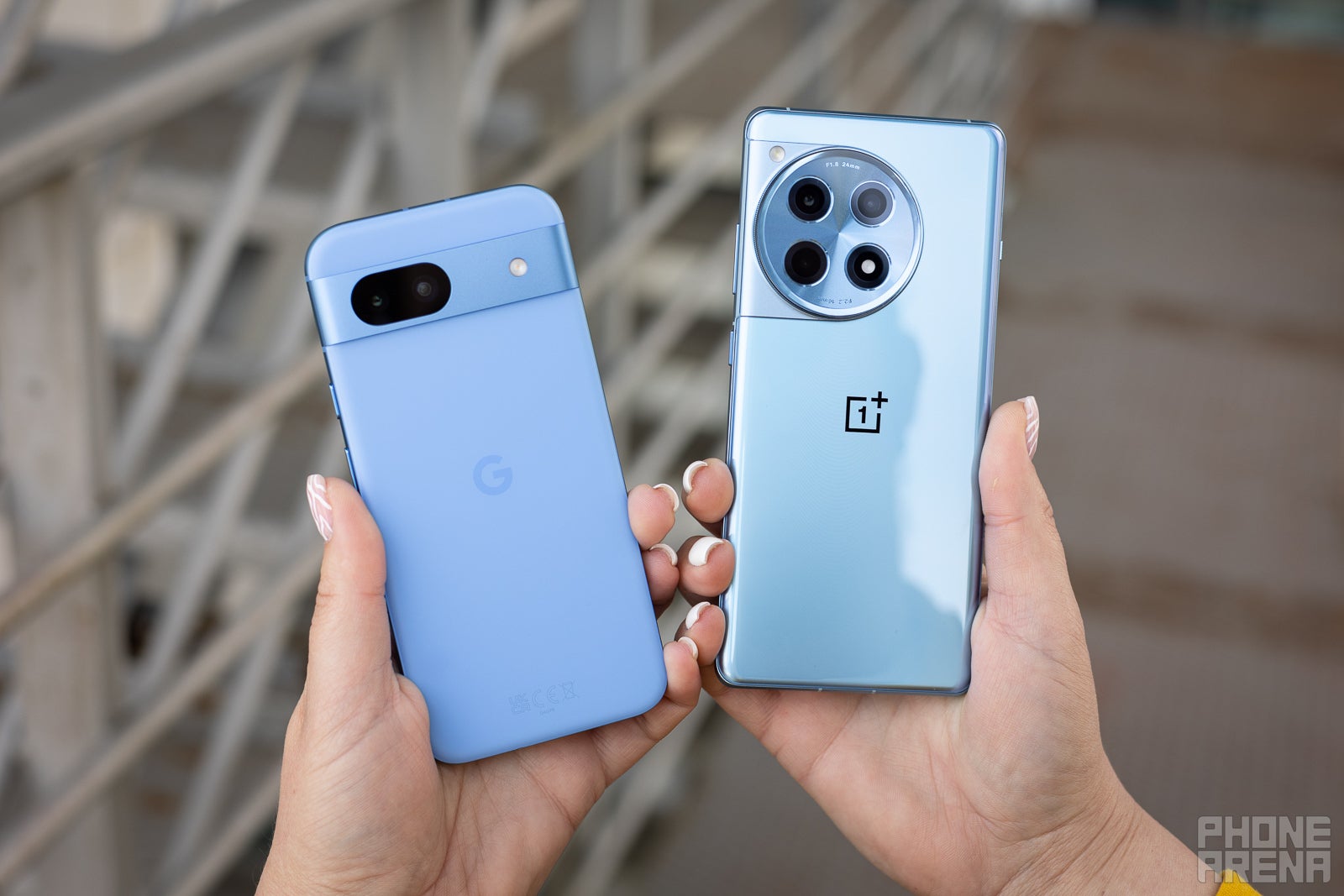 You can immediately see the contrasting matte and glossy backs of the Pixel 8a and OnePlus 12R in this image. (Image by PhoneArena) - Google Pixel 8a vs OnePlus 12R: The OnePlus mid-range game is strong this year