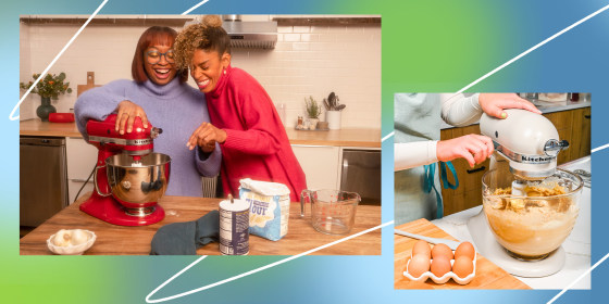 Two women in kitchen with red kitchen aid and hands on a white kitchen aid