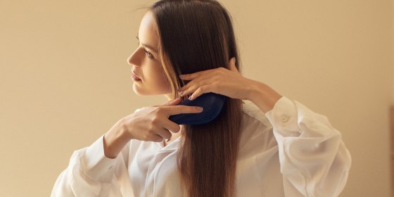 Girl brushing her hair