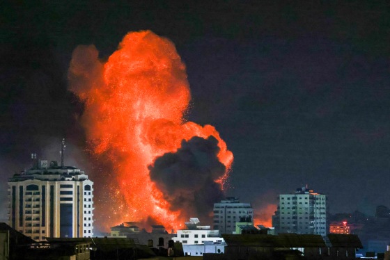 Image: A fireball erupts above Gaza City after an Israeli airstrike on Oct. 9.