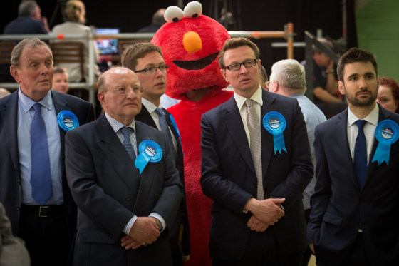 Elmo stands behind conservative supporters during the U.K. general election in 2015.