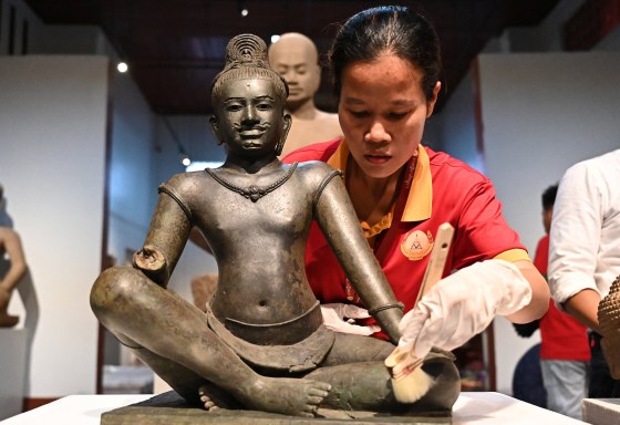 Buddhist monks in the Cambodian capital Phnom Penh chanted blessings and threw flowers on July 4 in a welcoming ceremony for 14 trafficked artefacts that were repatriated by a prestigious New York museum. 