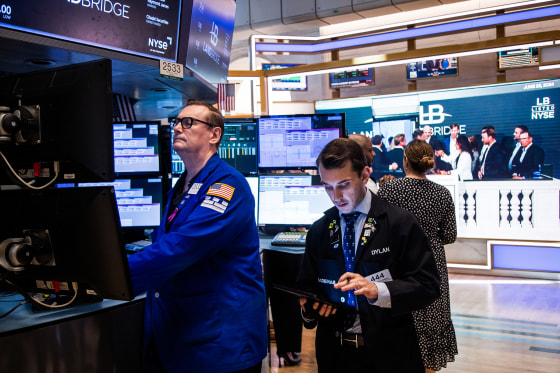 Traders work on the floor of the New York Stock Exchange