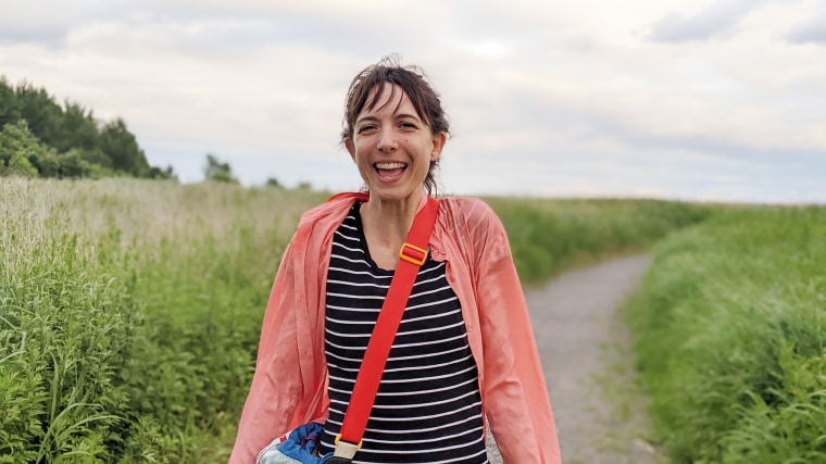 During their marathon wedding walk, the group split into two because the couple didn't have traditional bachelor and bachelorette parties. When Jessi Highet, wearing a wedding dress, filled her water bottle in a park, she helped a young girl fill water balloons.