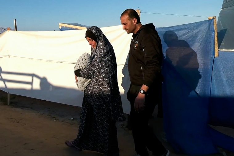 Baby Anas Stateh with his mother Wardeh and father Jalal in Rafah, southern Gaza.