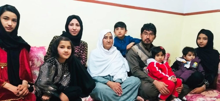 Zahra Shahnoory, left, and her family pose for a photograph