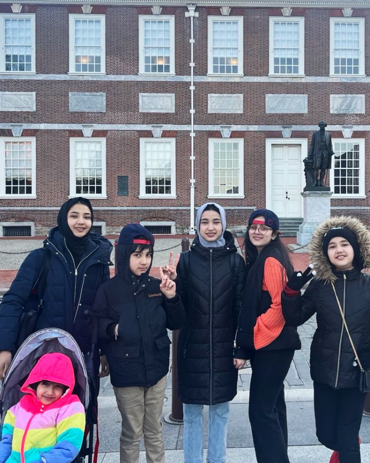 Zahra Shahnoory, left, and her siblings pose for a photo