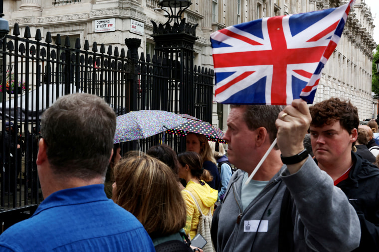 Tourists pass by Downing Street