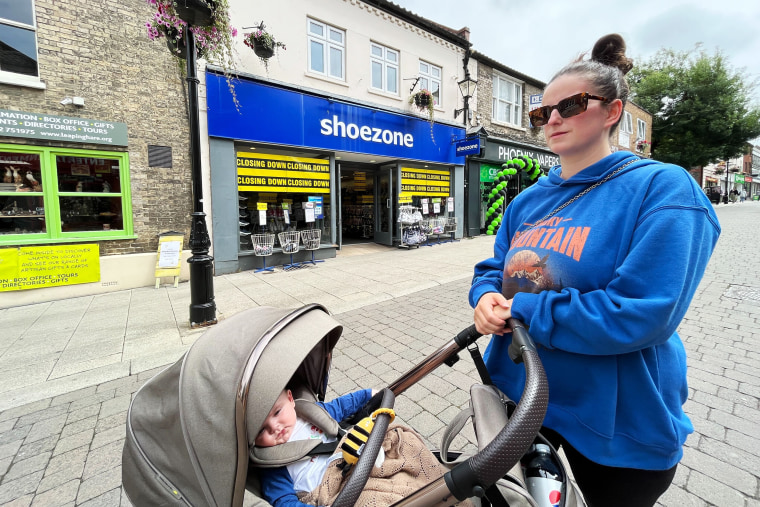 Lucy Howe, 26, with her son Louis in the morning after Britain's election. Under Conservative rule, the country endured a era of deep malaise and stagnation. Voters like her hope for a change.
