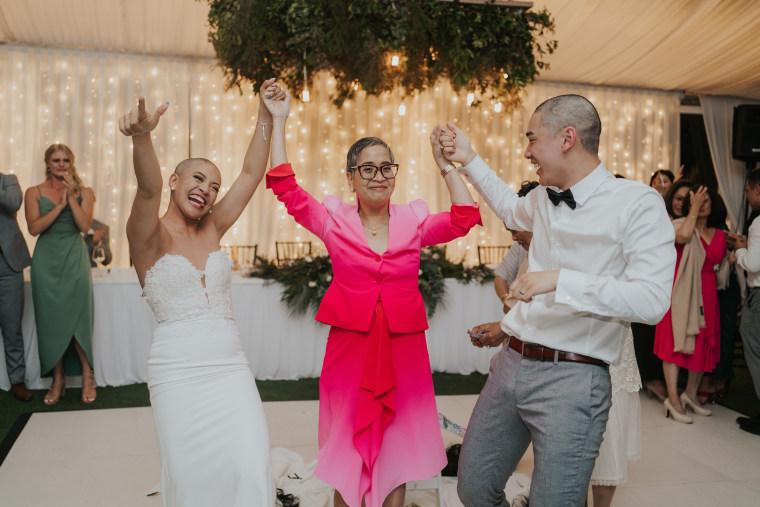 Couple shaving their hair during their wedding