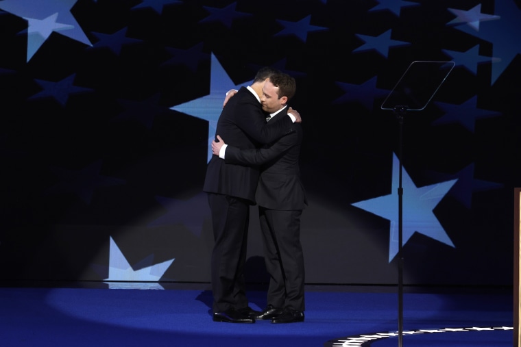 Second gentleman Doug Emhoff (L) greets his son Cole Emhoff as he arrives to speak on stage during the second day of the Democratic National Convention at the United Center on Aug. 20, 2024 in Chicago, Illinois. 