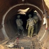 Israeli soldiers stand at the entrance of what the military says is the largest tunnel yet discovered in Gaza near the Erez crossing in the north of the enclave.