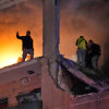 Civil defence workers search for survivors inside an apartment following a massive explosion in the southern suburb of Beirut, Lebanon, Jan. 2, 2024.