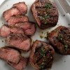 Omaha Steaks sirloins cut up on a plate