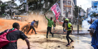 Protesters scatter as Kenya police spray water canons at them