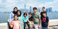 Zahra Shahnoory poses for a photo in front of the city skyline